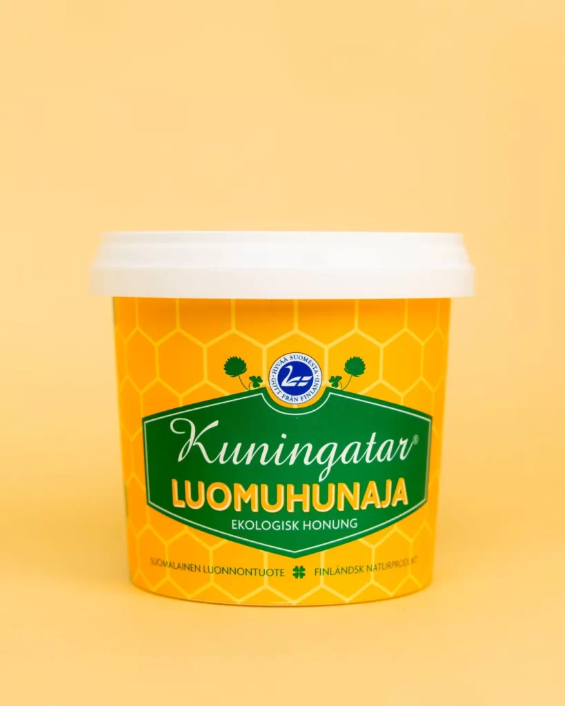 Kuva luomu Kuningatar hunajapurkista tuotekuva keltaisella taustalla